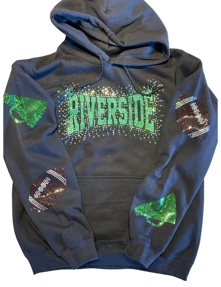 Flat lay of spangle apparel designs including t-shirts and hoodies with glittery sports graphics.